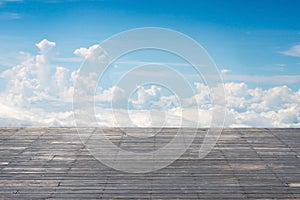 Old vertical striped wooden terrace with sunny sky cloudscape