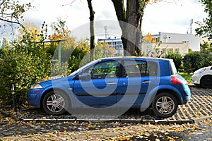 Old veteran metal blue French Renault Megane II with diesel 1.9 engine compact car parked