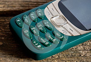 Old, vibrant green mobile phone