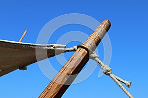 Old vikings tent made of cloth and wood in front of a blue sky