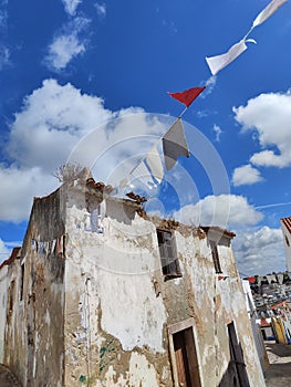 Old village house flags wind