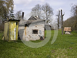 Old village house with outbuildings.