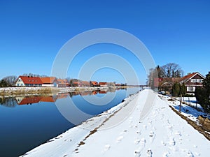 Old village Minge and river in winter, Lithuania