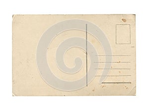 Old vintage aged empty paper postcard texture with faded stamp print and brown stains isolated on white