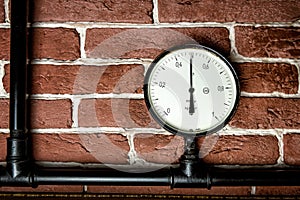 Old vintage analog manometer on steam power machine