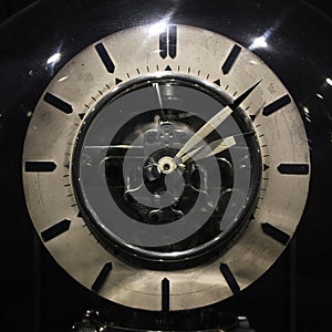 Old vintage antique clock on black background