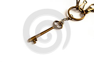 Old vintage antique golden key on white background