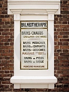Old vintage balneotherapy french sign on ceramic tiles photo