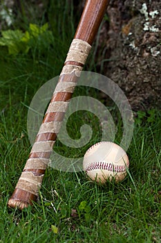 Old Vintage Baseball and Wooden Bat