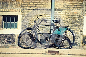 Old vintage bicycle against a beautiful brick wall. Transport. Bicycles.