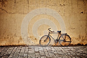 Old vintage bicycle near the wall