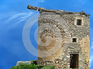 Old vintage big castle tower against blue sky background