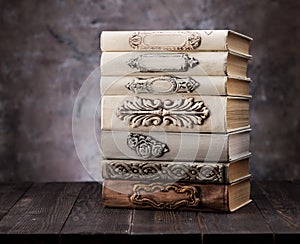 Old vintage books on a wooden shelf