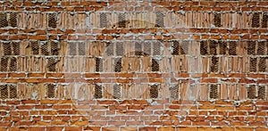 Old vintage brick wall, old texture of red stone blocks closeup