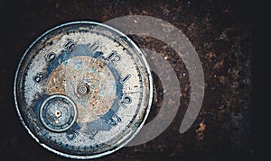 An old vintage broken mechanical watch. Dark grunge background