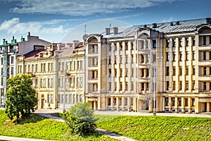 Old vintage building facade with windows and balcony. Vintage building facade wall. Classic European architecture.