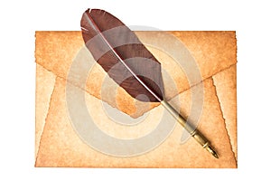 Old vintage burned envelope letter with quill feather pen isolated on a white background