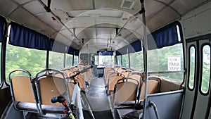 Old vintage bus from inside driving. Driving Empty Bus. Old design bus seats