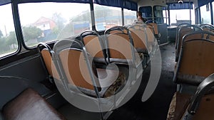 Old vintage bus from inside driving. Driving Empty Bus. Old design bus seats