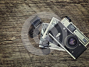 Old vintage camera closeup on wooden background