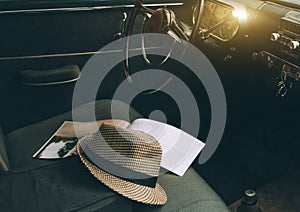 Old Vintage car interiors with cap and information book