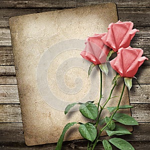 Old vintage card and a bouquet of roses