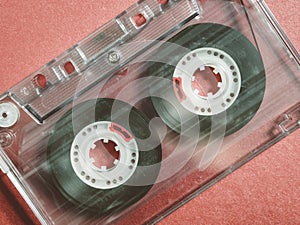 Old vintage cassette tapes on red background