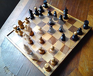 Old vintage chess on wooden table