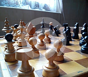 Old vintage chess on wooden table