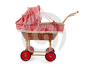 An old vintage childrens doll stroller