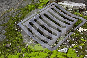 Old vintage city sewer grate road drainage