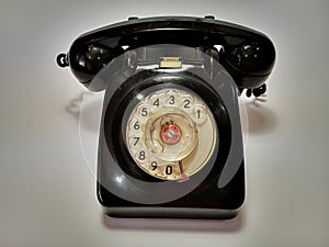 A vintage and antique telephone with white background. photo