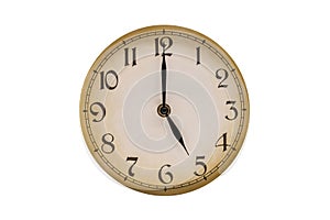 Old vintage clock face. Five o'clock on the clock