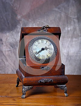 Old Vintage clock on old wood