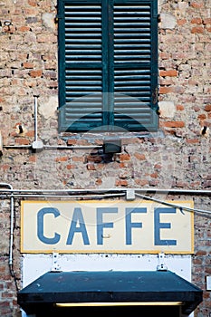 Old vintage coffee sign in Italy - Concept of retro, traditional CaffÃ¨ design photo