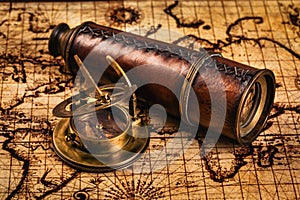 Old vintage compass on ancient map