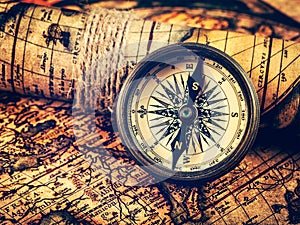 Old vintage compass on ancient map