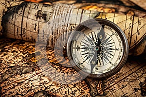 Old vintage compass on ancient map