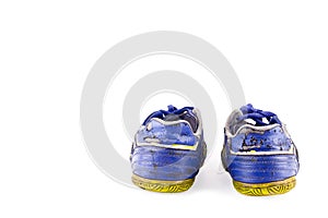 Old vintage damaged futsal sports shoes on white background football sportware object isolated