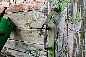 Old vintage door handles. Rusty metal locks and latches.