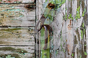 Old vintage door handles. Rusty metal locks and latches.