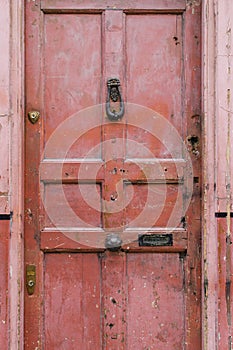 Old vintage english style red salmon pink front door with age re