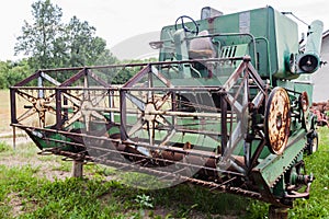 Old vintage farming agricultural harvester