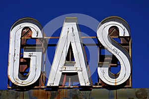 Old Vintage Gas Cafe Sign with Blue Sky Worn Americana