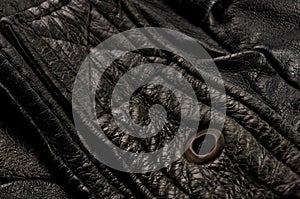 Old vintage genuine soft black leather texture background, top layer with pores and scratches, macro, close-up