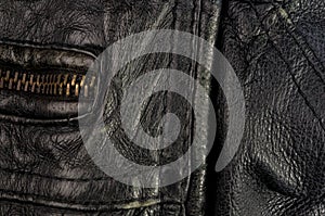 Old vintage genuine soft black leather texture background, top layer with pores and scratches, macro, close-up