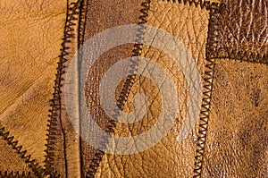 Old vintage genuine soft brown leather texture background, top layer with pores and scratches, macro, close-up