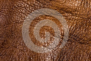 Old vintage genuine soft brown leather texture background, top layer with pores and scratches, macro, close-up