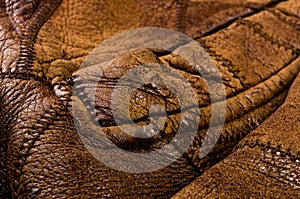 Old vintage genuine soft brown leather texture background, top layer with pores and scratches, macro, close-up