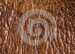 Old vintage genuine soft brown leather texture background, top layer with pores and scratches, macro, close-up